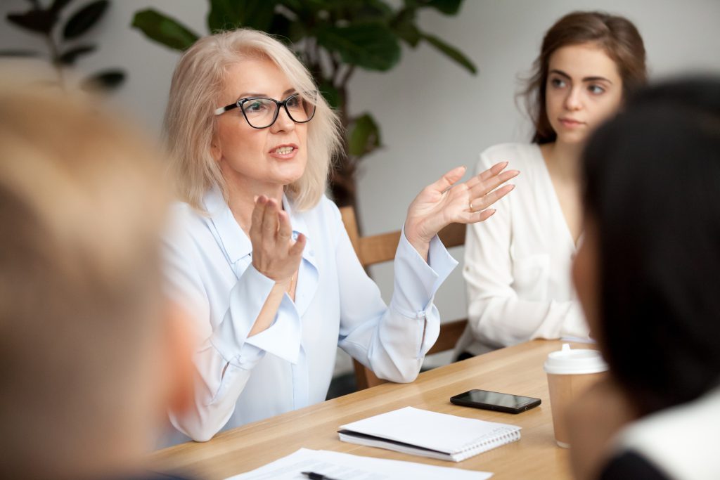 Business woman talking to colleagues