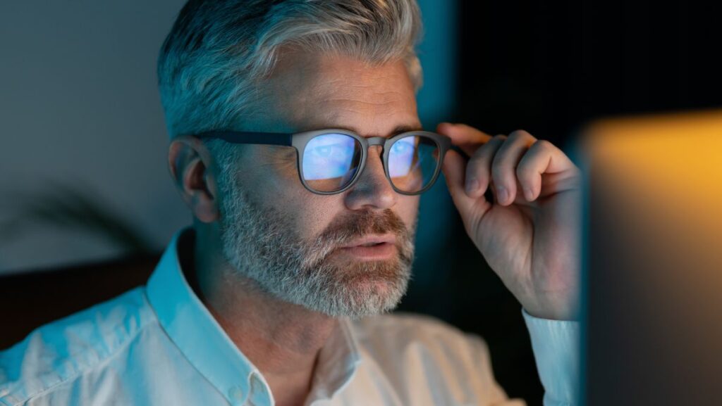 Image of Commercial Debtor looking at screen